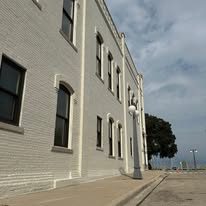 Finished white painted three story commercial building exterior