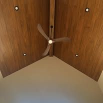 Vaulted wood tongue and groove ceiling with fan