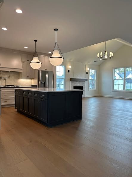 Open great room with dark kitchen island