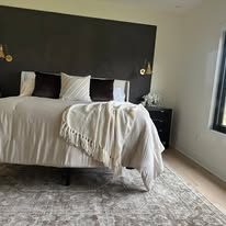 Bedroom with black mineral wash accent wall
