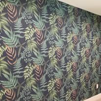 Living room with botanical print accent wallpaper