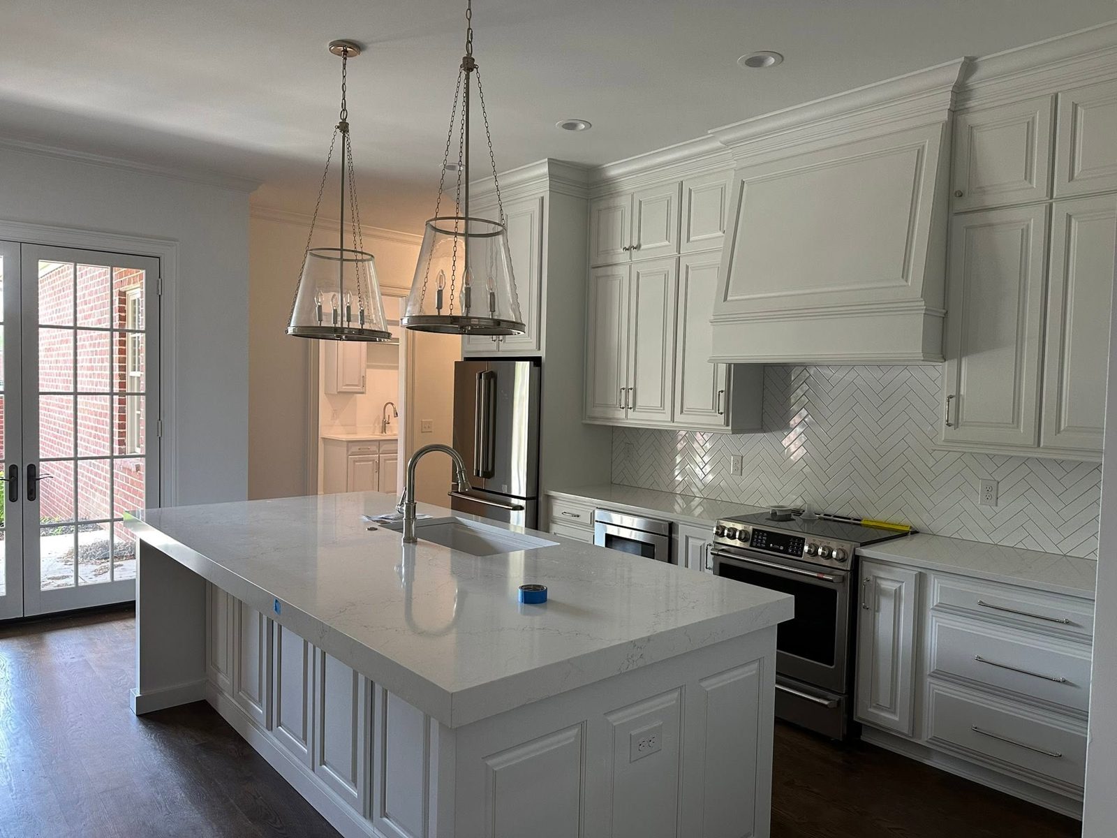 White kitchen with large island